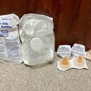 5 infant nipples & six 4 ounce infant bottles